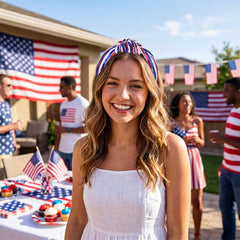 PARTY TELLER headband held in hand to show size and lightweight feel
