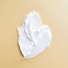 PATTERN heavy conditioner in palm demonstrating thick slip for detangling