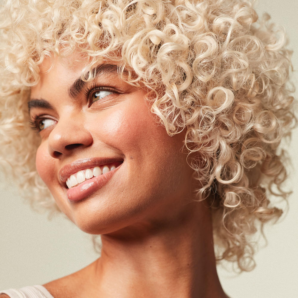 Paul Mitchell in-shower use on blonde hair showing brass-reducing action and easy rinse