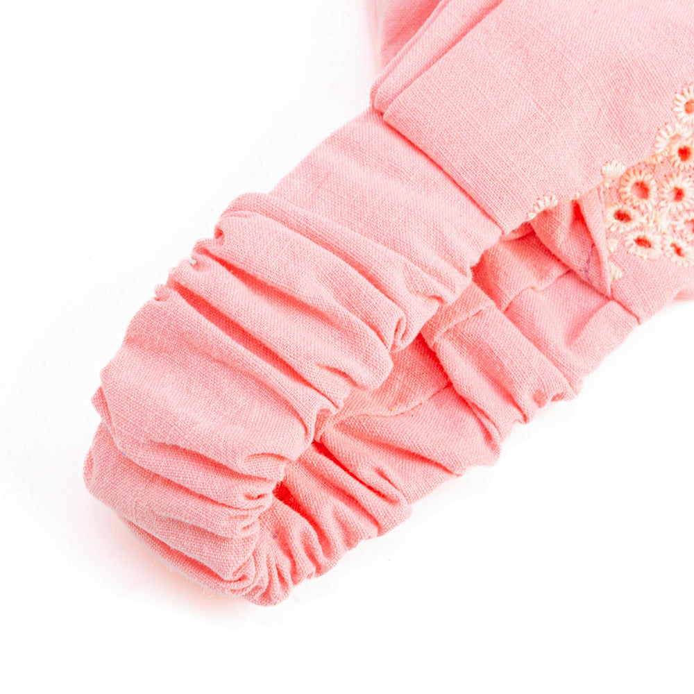 Peppercorn Kids textured cotton fabric detail showing breathable weave benefit