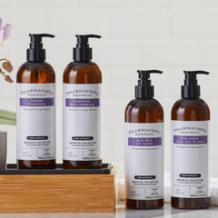 Pharmacopia bottle on hotel bathroom shelf conveying premium guest care