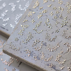 Phuryllic macro of gold leaf detail delivering metallic shine and accenting nails