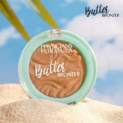 Physicians Formula bronzer next to everyday items showing mini size convenience