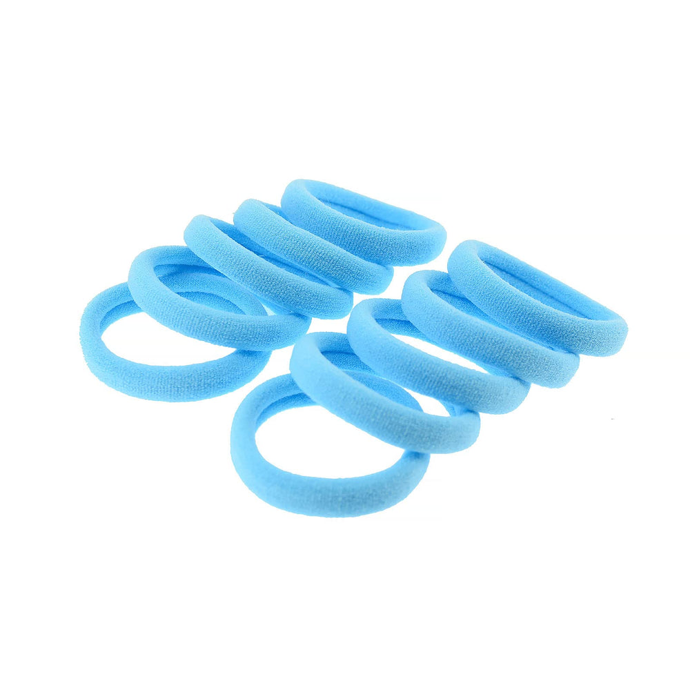 PIDOUDOU hair ties spilling from a gym bag for quick-access, travel-ready use
