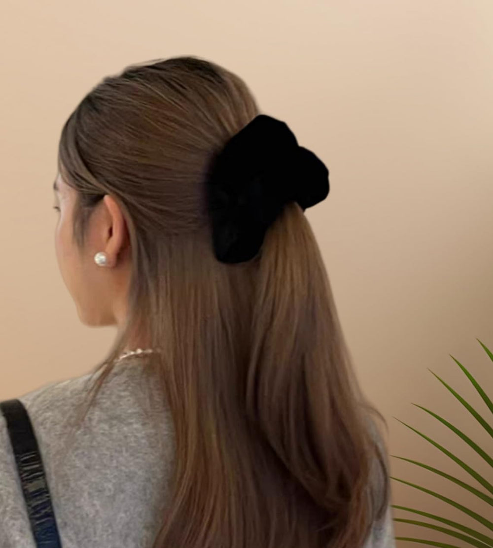 PIDOUDOU scrunchie in hand showing 5.5 inch size for thick hair visibility