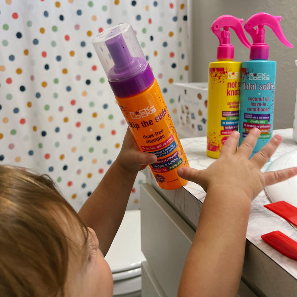 Piggy Paint applied to child's hair during quick touch-up for fresh, odor-free hair