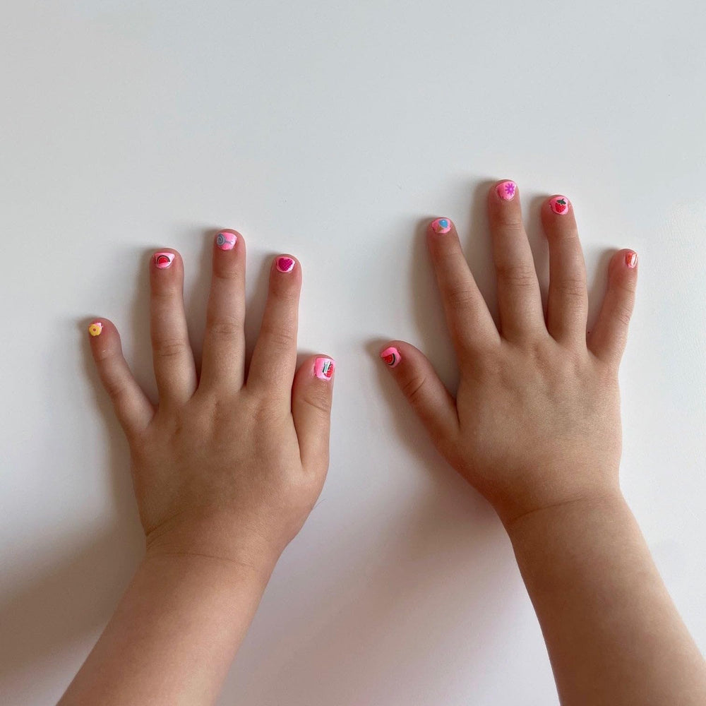 Piggy Paint nails drying with hairdryer demonstrating quick set for better wear