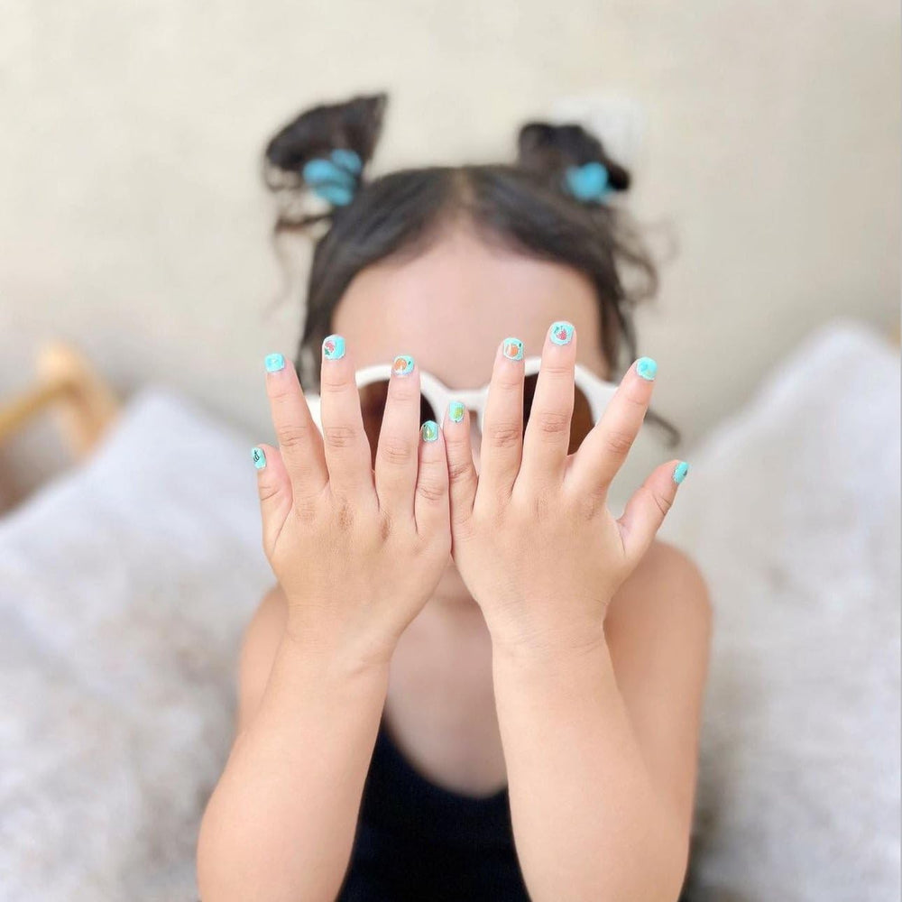Packaging and ingredient list for Piggy Paint highlighting non-toxic claims