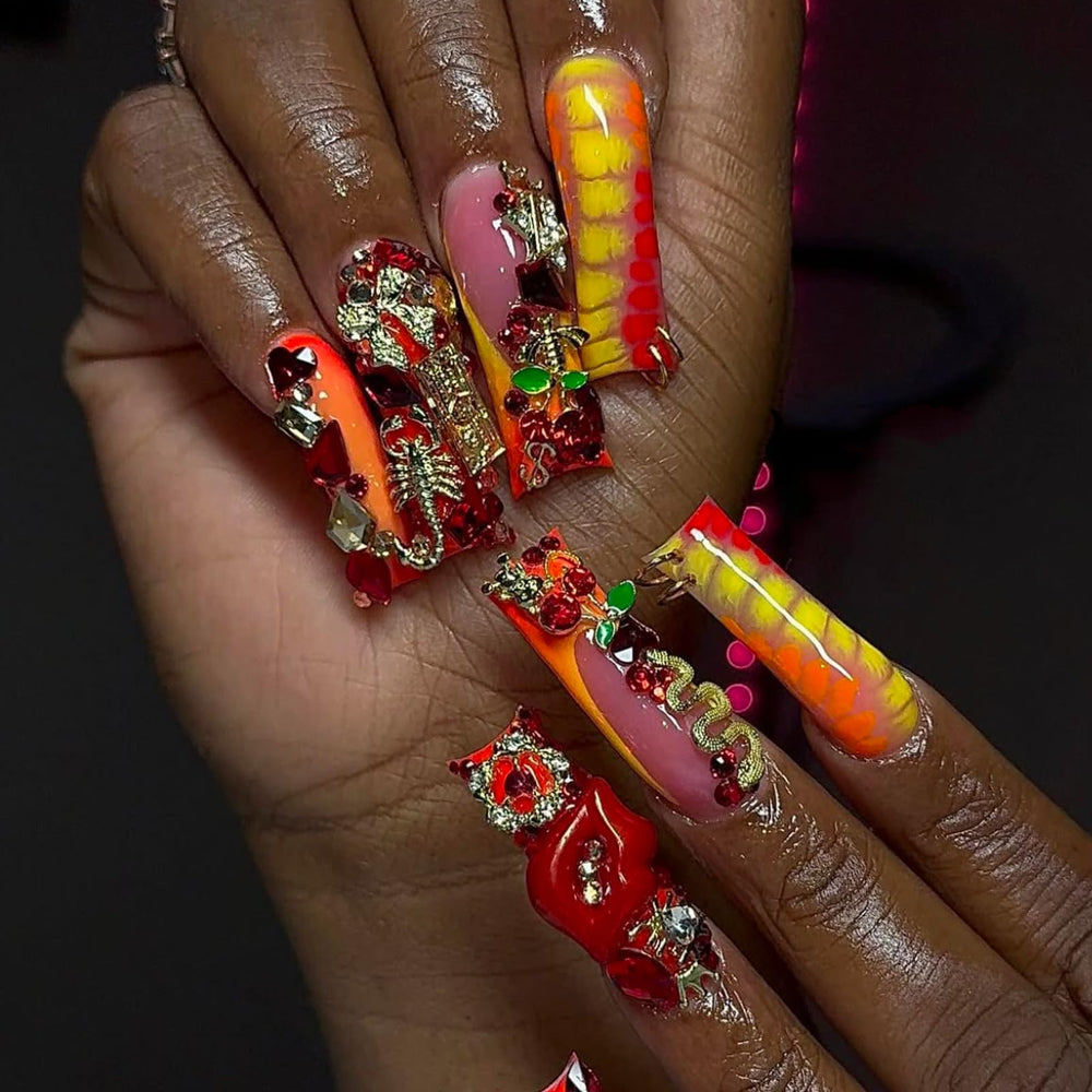 Pizadix lifestyle shot of manicured hands wearing charms for party-ready nails