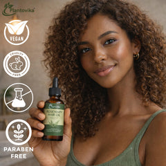 Plantovika 2 fl oz bottle being held for scale illustrating travel-friendly size