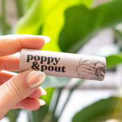 Poppy & Pout recyclable cardboard tube close-up showing eco-friendly benefit