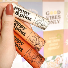 Poppy & Pout recyclable cardboard tube displayed to show eco‑friendly packaging benefit