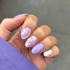 Posyofet side profile showing almond curve on a nail, demonstrates natural fit benefit