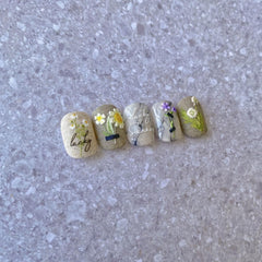 POWPOP summer manicure lifestyle shot showing floral stickers enhancing nails