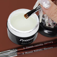 Present brushes packed in travel pouch for portable salon convenience