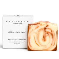 Pretty farm girl front packaging shows citrus cedarwood label and eco benefit
