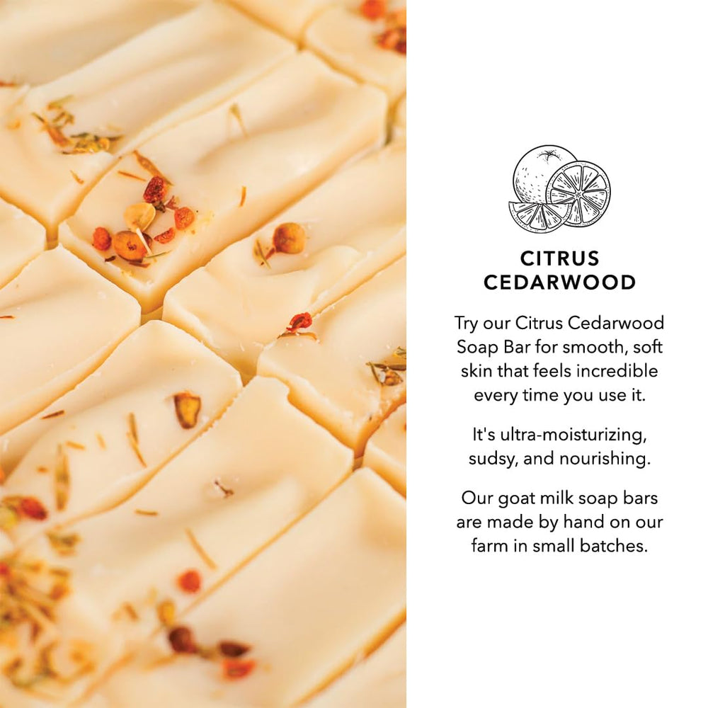 Pretty farm girl soap placed near citrus and cedarwood for ingredient clarity benefit