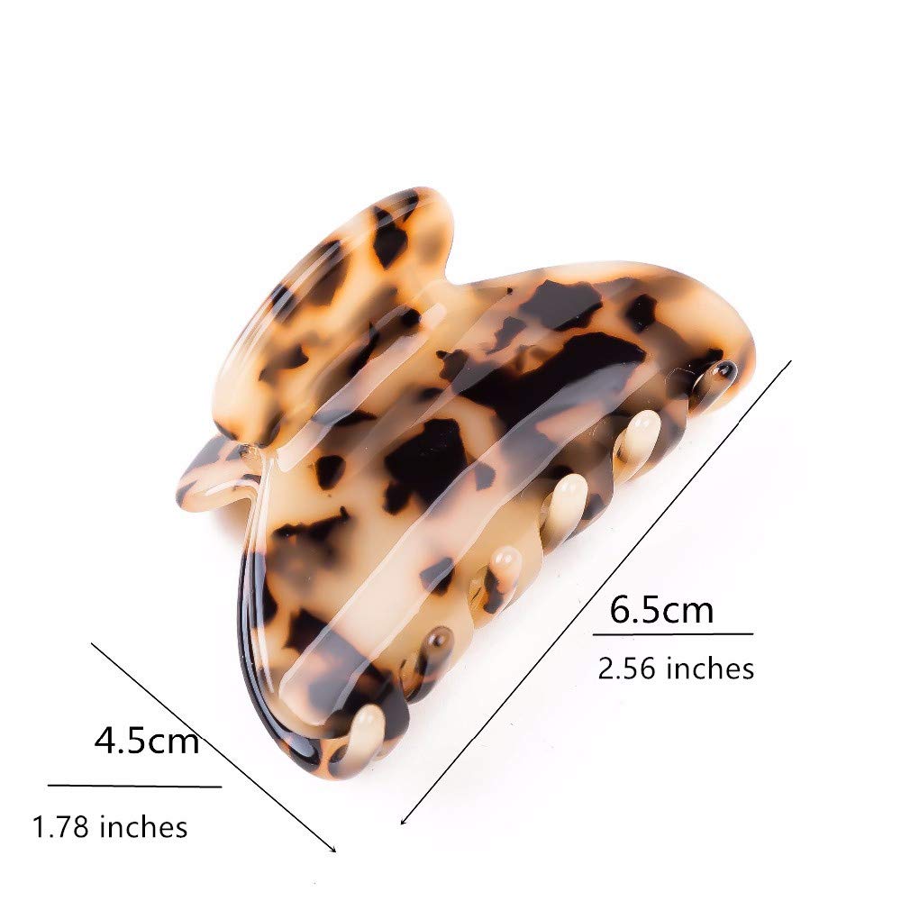 Prettyou clip next to a hand for scale showing medium size and portability