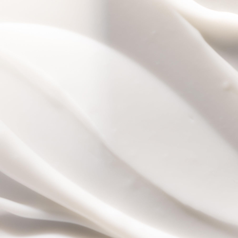 Pureology hydrate sheer being applied to damp hair demonstrating detangling benefit