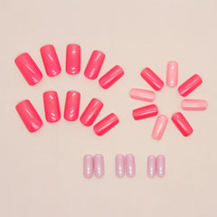 Puyokinm lifestyle shot of woman wearing pink aurora nails for instant salon look