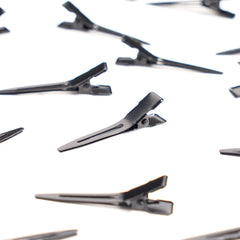 Qearl clip used by stylist sectioning hair to speed up styling