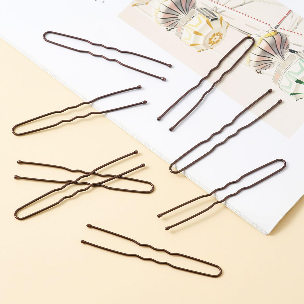 QIUTIMIY close-up of metal U-pin smooth tips preventing hair snagging and discomfort