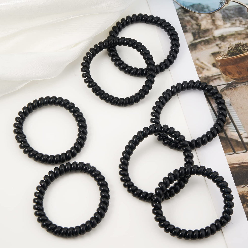 QIUTIMIY coil beside ruler for size comparison, showing 1.97 inch diameter clarity