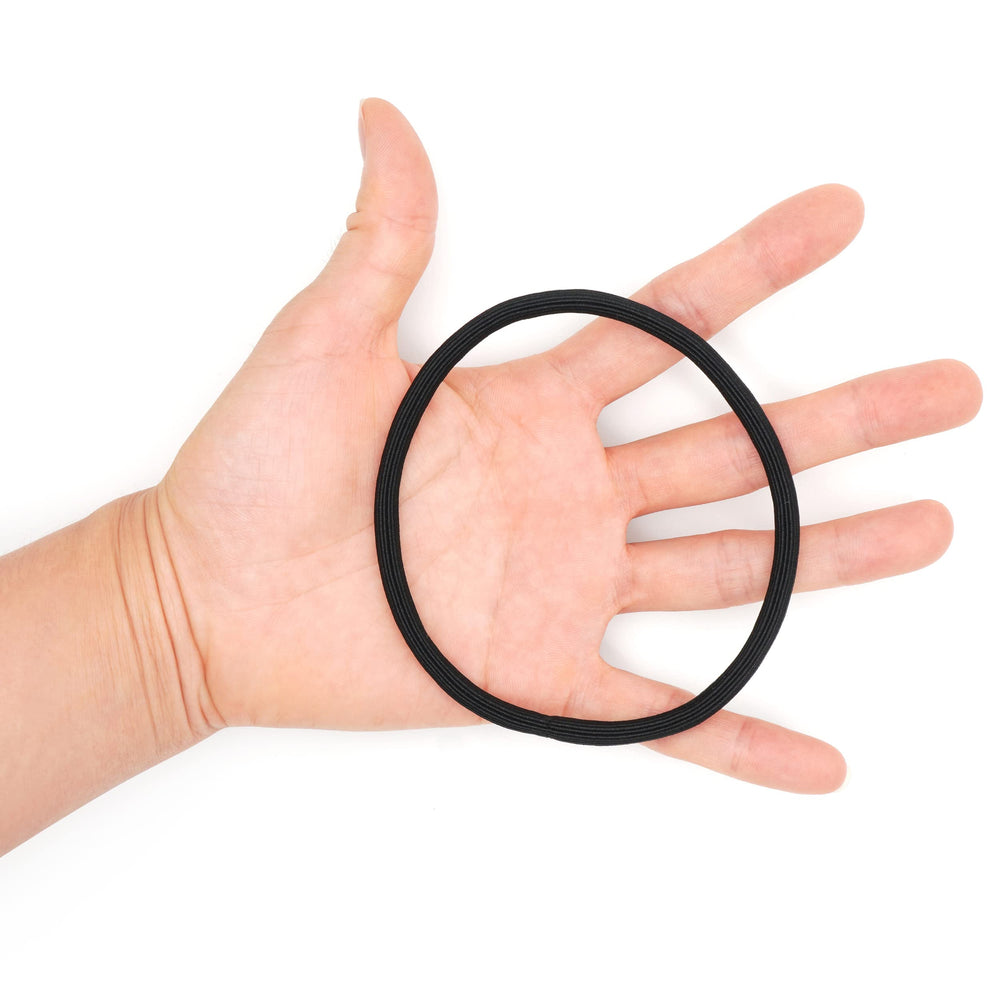 Qooocy beside hand for scale illustrating extra-long size advantage