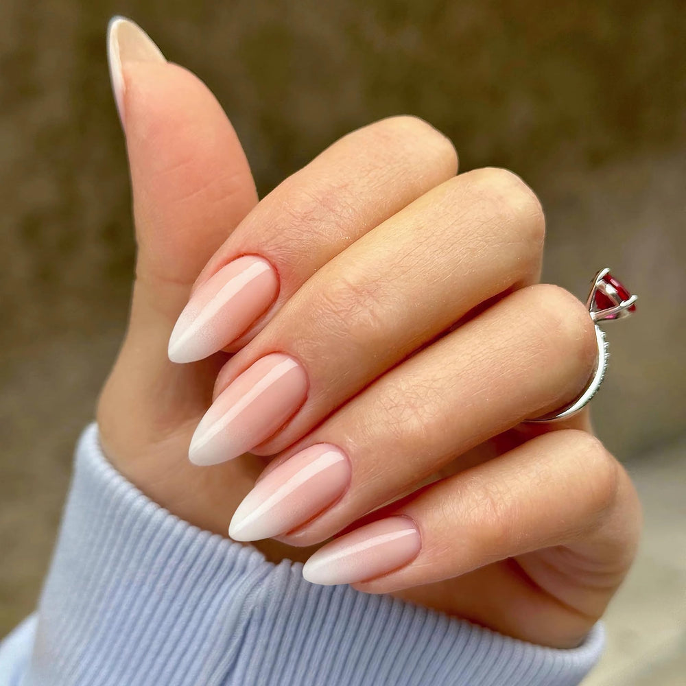 Qsnidy close-up of ombre nude-to-white shades showing salon-like glossy finish