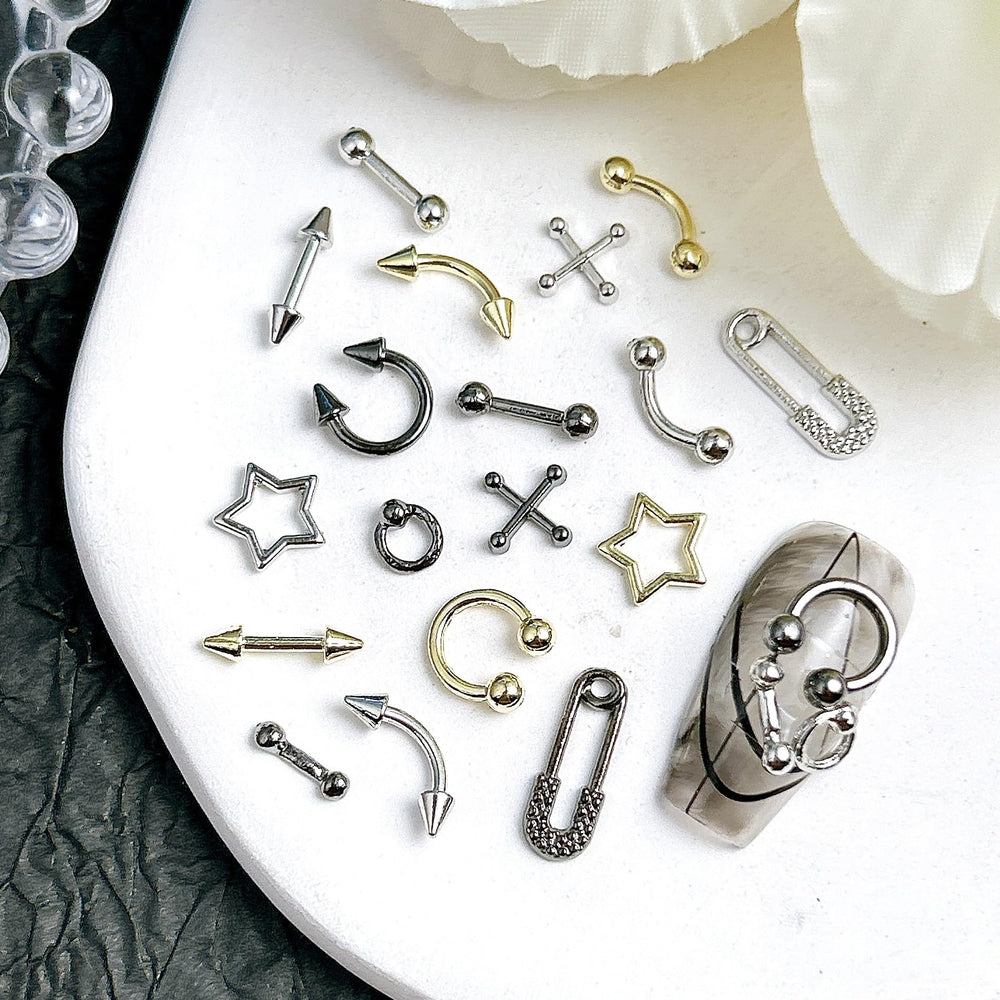 Quezadyl assorted charms spread showing variety useful for creative designs