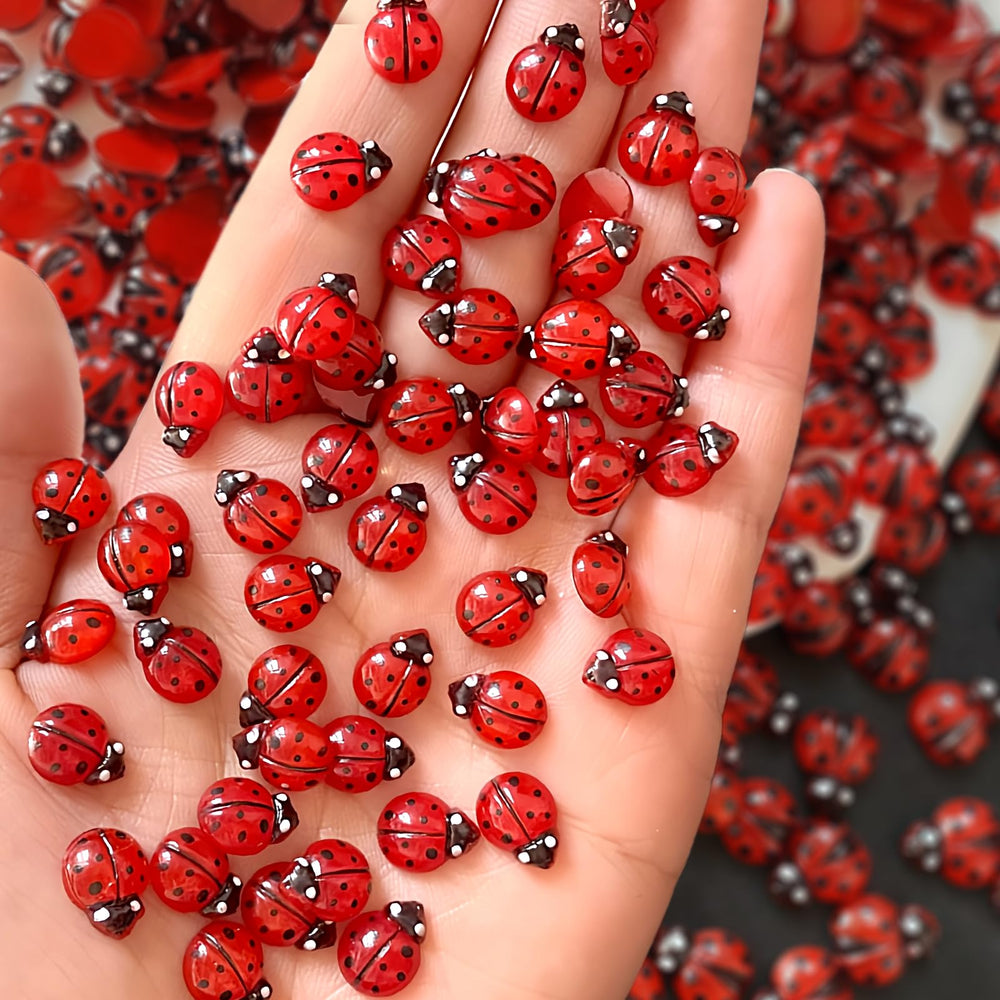 Quezadyl front packaging showing 100-piece ladybug nail charms and easy variety