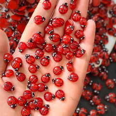 Quezadyl front packaging showing 100-piece ladybug nail charms and easy variety