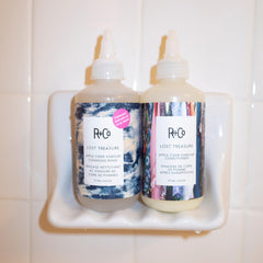 Hair with enhanced shine after R+Co rinse, showing glossy, soft-looking results and improved texture