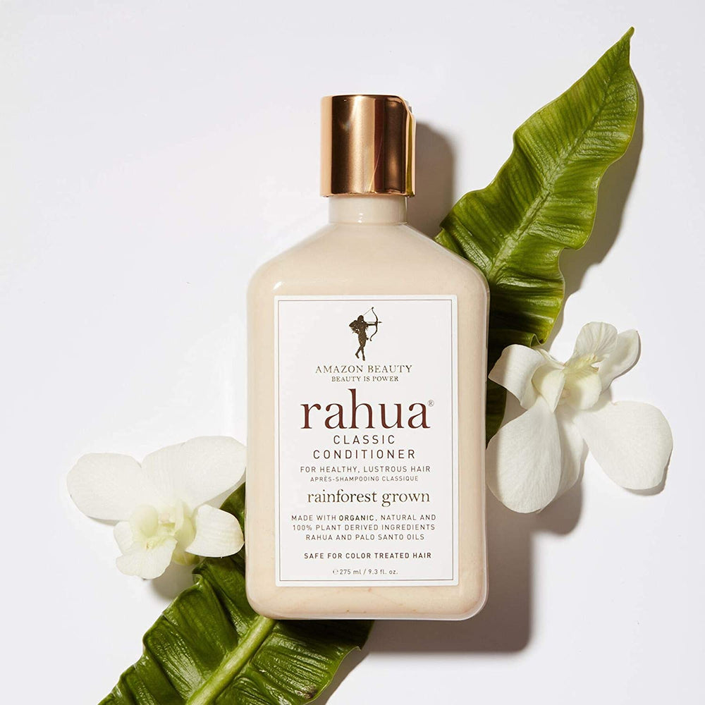 Rahua 9.3 fl oz bottle beside common items illustrating true size and travelability