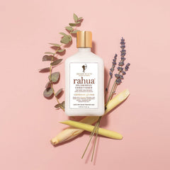 Rahua bottle in hand for scale illustrating the 9.3 fl oz travel-friendly size