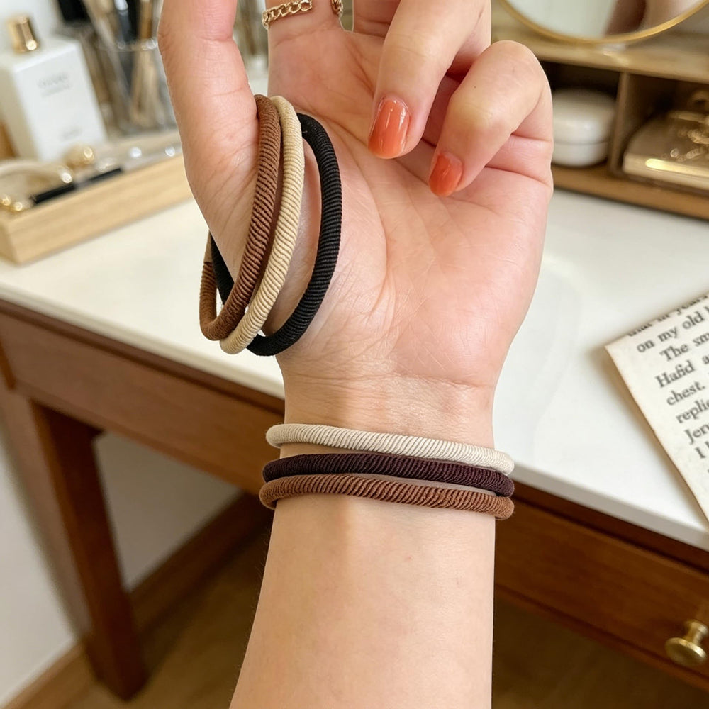 Random Mood band stretched to show elasticity and firm hold for thick hair