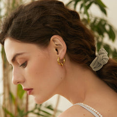 Ravlzors scrunchie on high ponytail holds style without creases