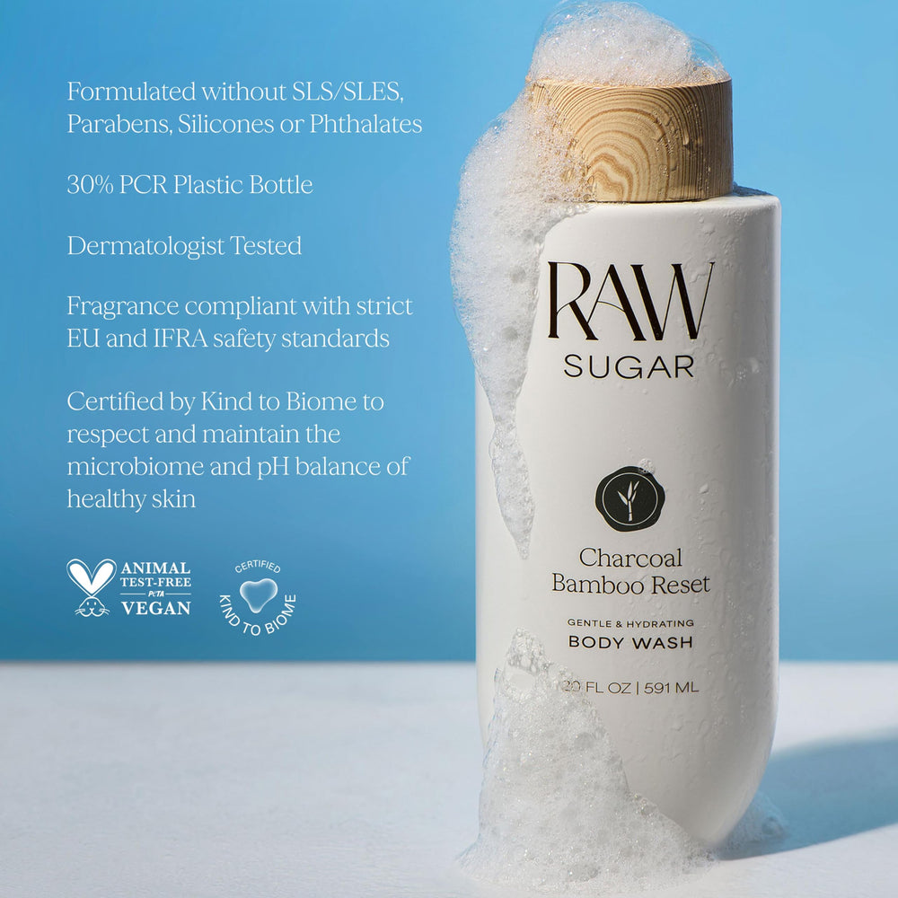 RAW SUGAR bottle held in hand to show scale and travel-friendly 20 fl oz convenience