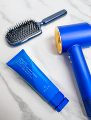 R+Co BLEU being applied to damp hair for detangling