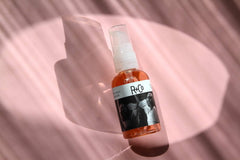 R+Co two way mirror packaging label closeup showing ingredient clarity benefit