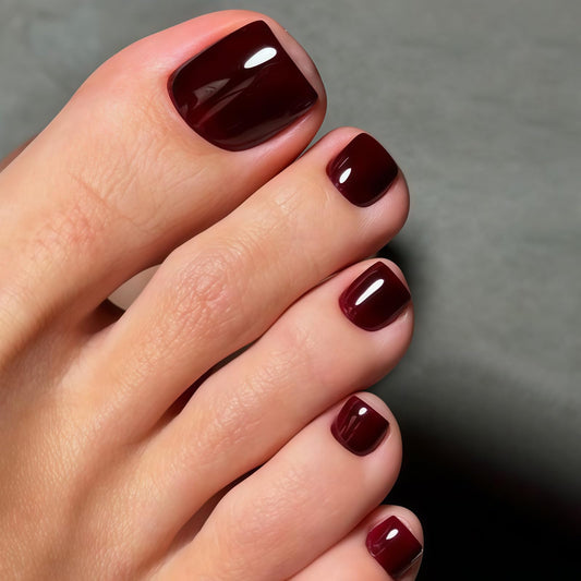 Rdntbeu front packaging showing burgundy short square toenails and kit contents for quick styling