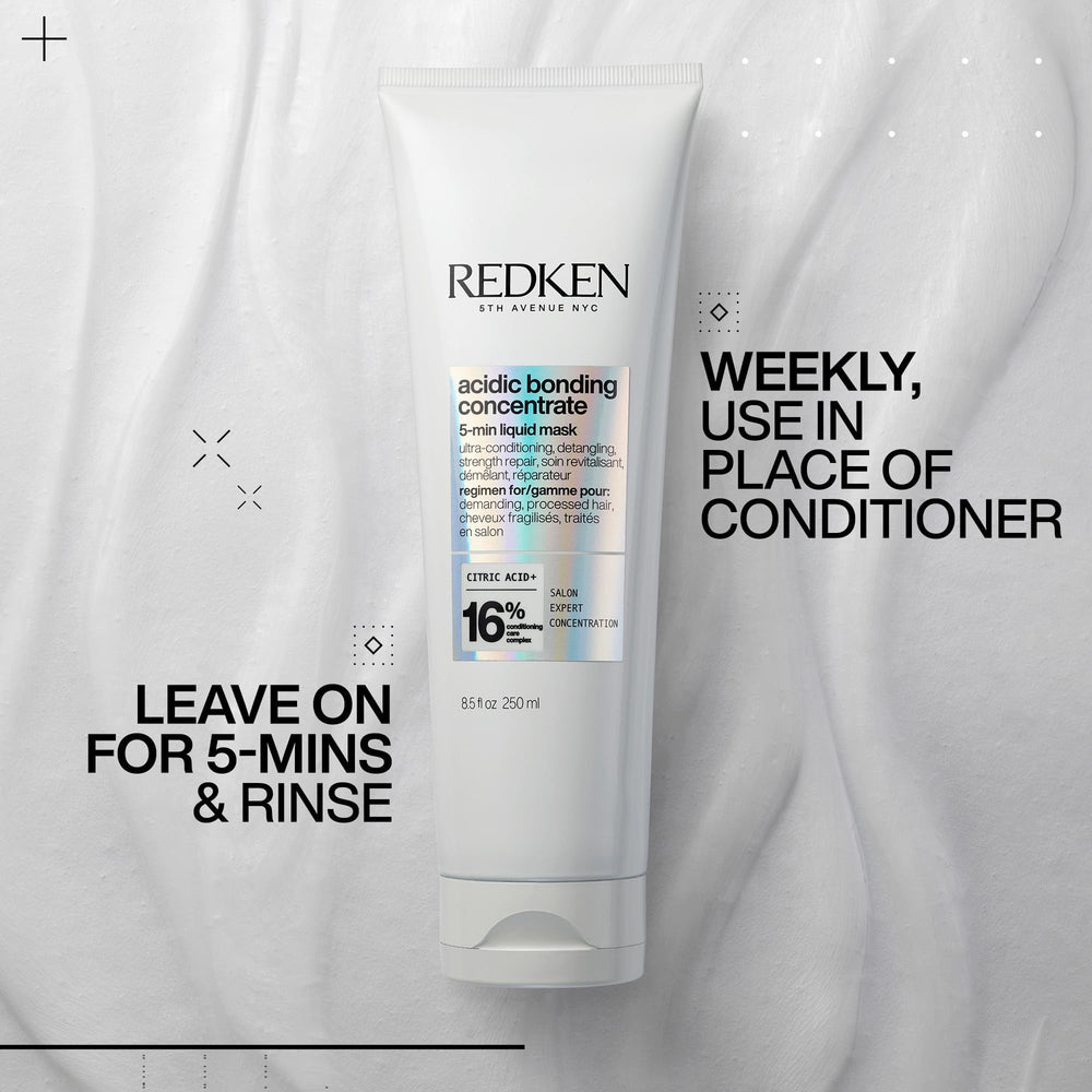 Redken mask being worked through wet hair mid-lengths showing detangling benefit