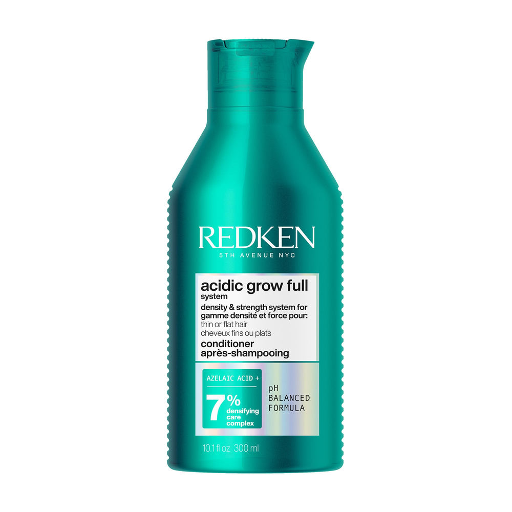 Redken bottle front view showing product and volumizing benefit