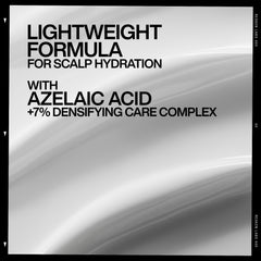 Close-up of Redken label highlighting densifying complex ingredients