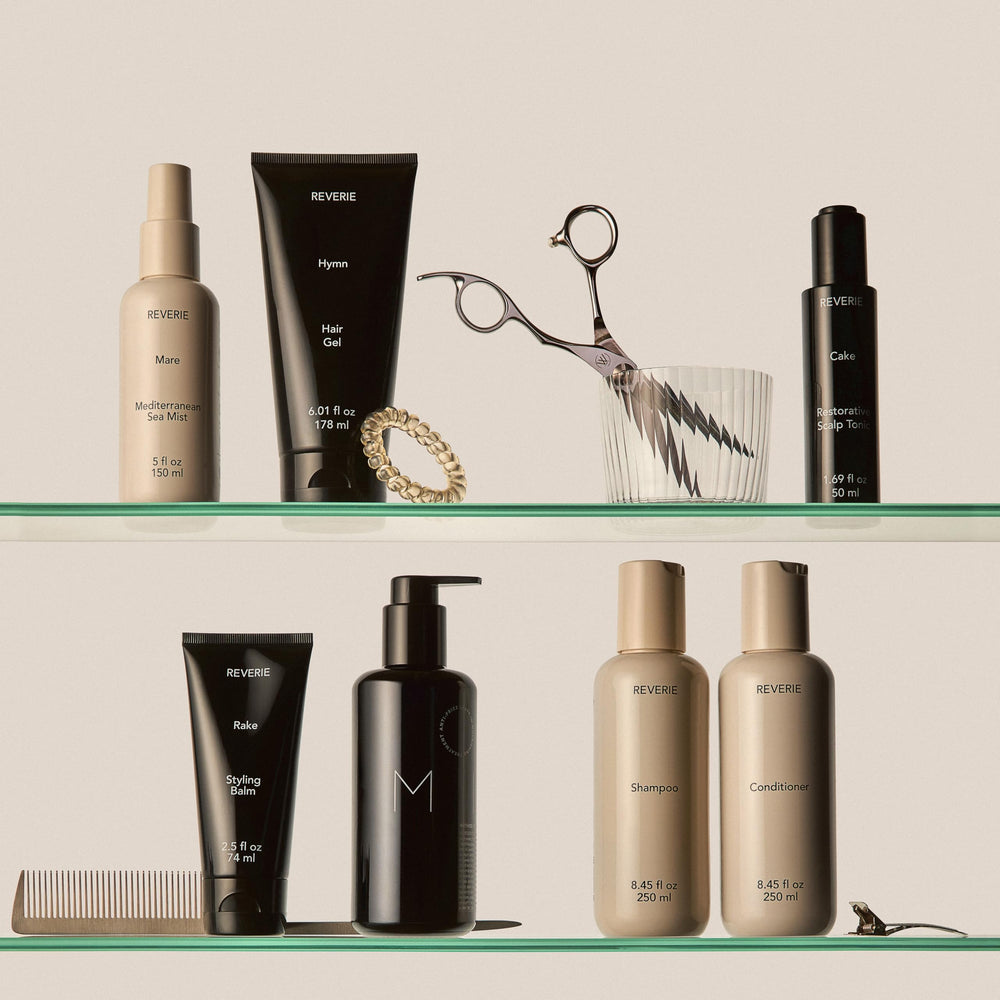REVERIE finishing balm smoothing an updo to show polished, tame ends
