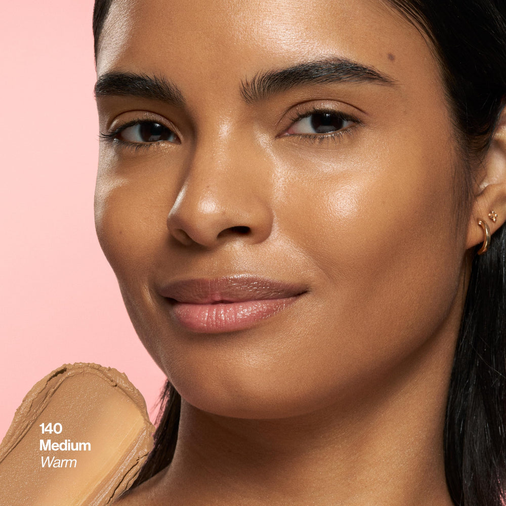 Revlon Glimmer stick being applied to cheek for instant natural radiance