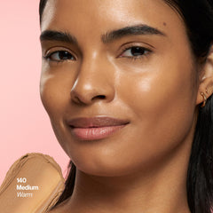 Revlon Glimmer stick being applied to cheek for instant natural radiance
