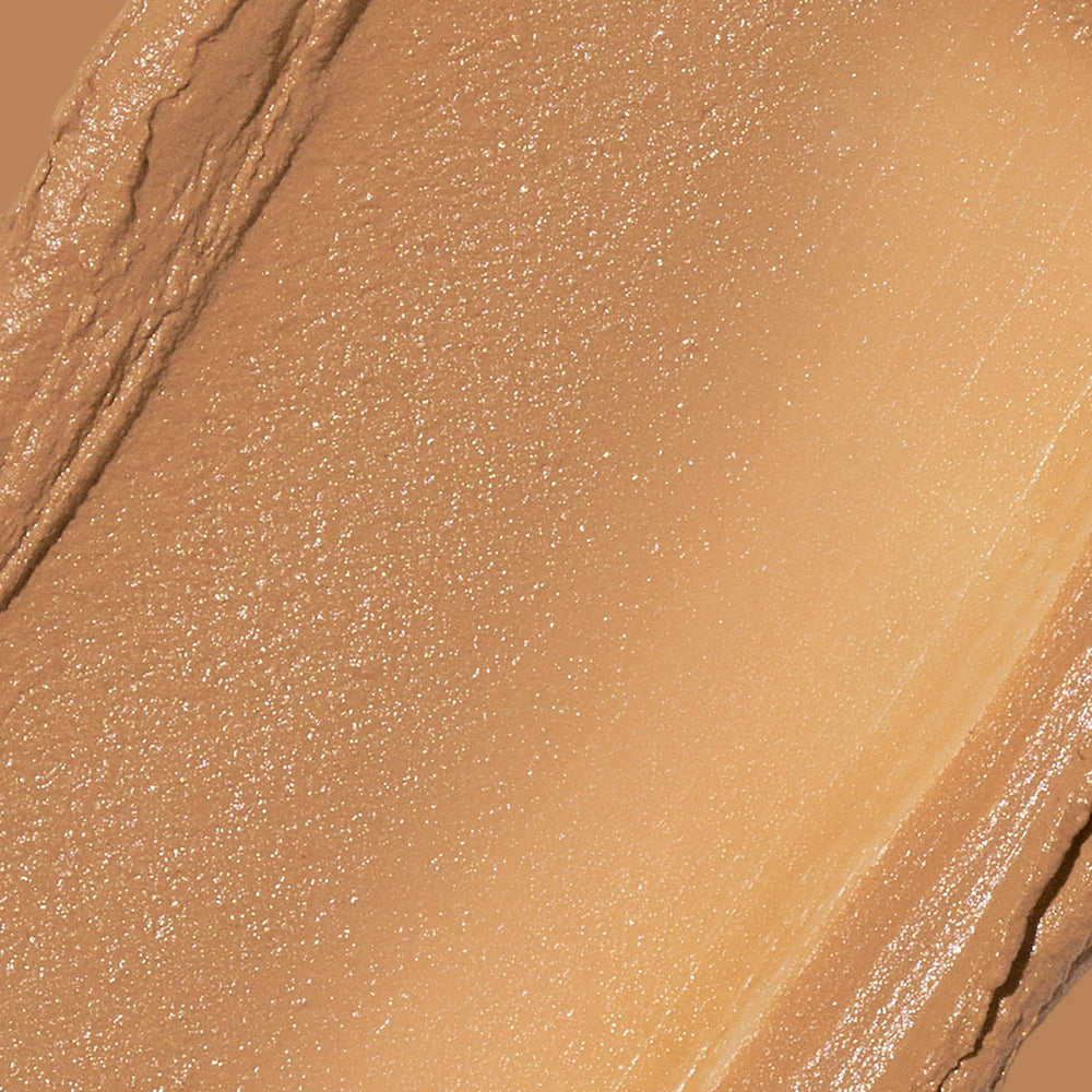 Revlon Glimmer stick creamy texture close-up illustrating smooth blendability