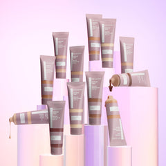 Revlon Illuminance tube in hand showing compact 0.94 fl oz size for travel convenience