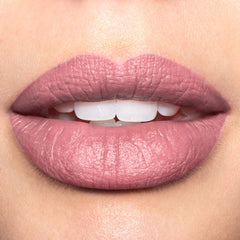 Arm swatch of Revlon Candy Addict showing rich matte pigment and creamy finish for true-to-shade color